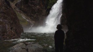 Leslie standing and watching the falls
